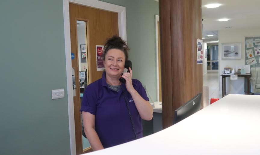 Member of supported living team speaking to a customer on the phone