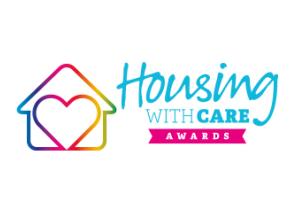 Colorful Housing with Care Awards badge, featuring a house outline with a heart in gradient hues
