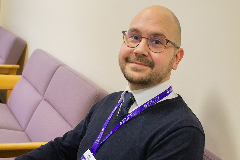 Care Quality Commission (CQC) Co-ordinator, pictured seated in a Sanctuary office