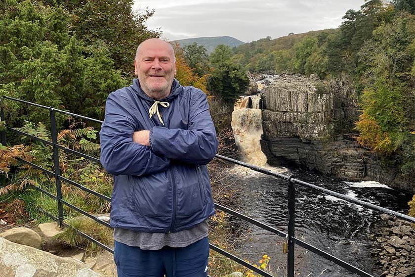 Station Road resident standing in front of a waterfall