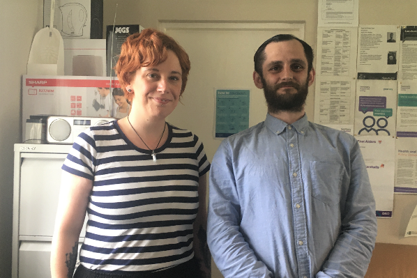 Staff member with resident photographed in a scheme's office