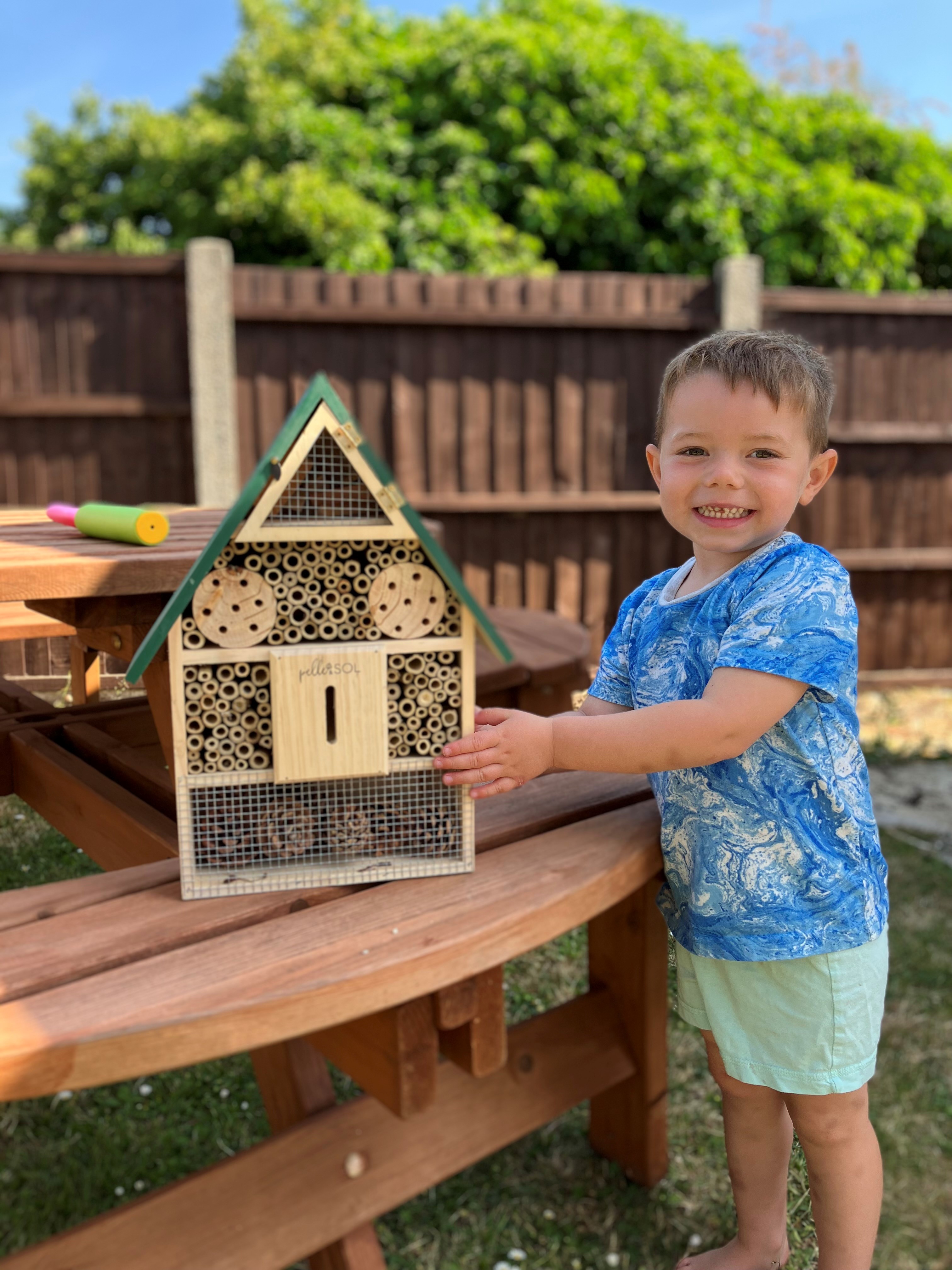 Resident of Ruth House, proudly smiling with his bug house