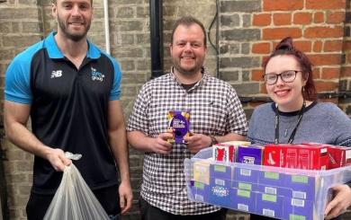 Gym volunteer Charlie Mawson and Project Workers Samuel Siggins and Katie Mular with Easter egg donations