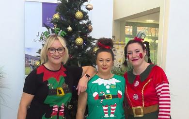 The team at Jazz Court  wearing Christmas outfits