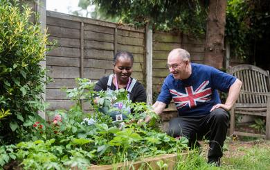 Jet Lengalenga and Resident Kevin Saunders in the garden at Compton Road