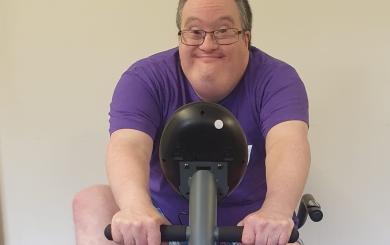 Tilmore Gardens resident exercising on an exercise bike 