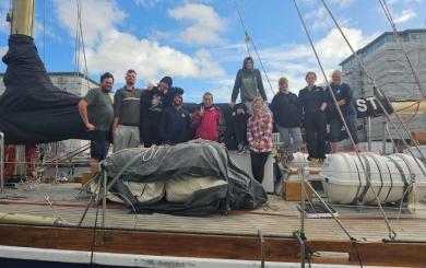 Residents of the scheme on board a sailing boat