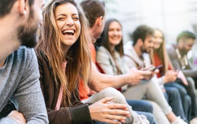  A group of young people smiling and chatting