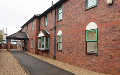 Exterior image of Victoria Road a long, two storey building 