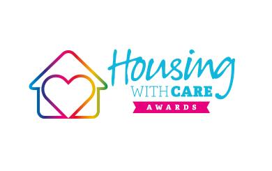 Colorful Housing with Care Awards badge, featuring a house outline with a heart in gradient hues