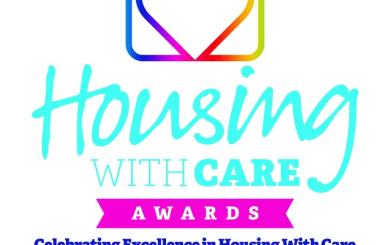Colorful Housing with Care Awards finalist badge, featuring a house outline with a heart in gradient hues