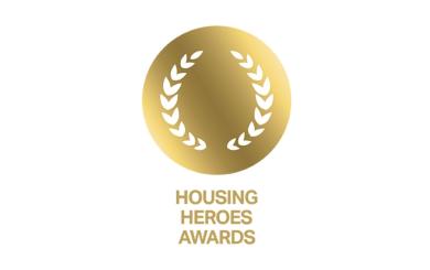 Gold circular laurel wreath graphic with the words “Housing Heroes Awards” underneath