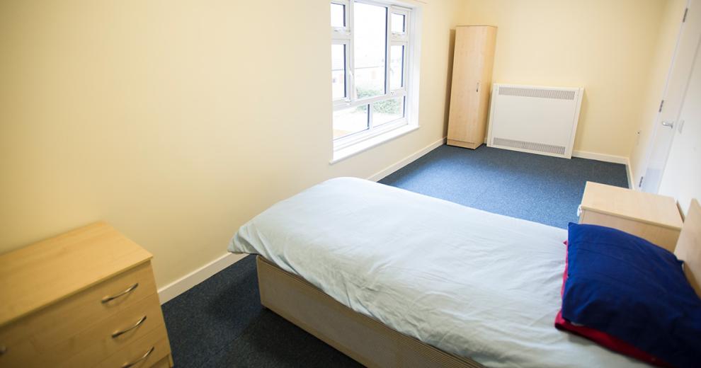 Generous sized, neutral, furnished, single occupancy bedroom.