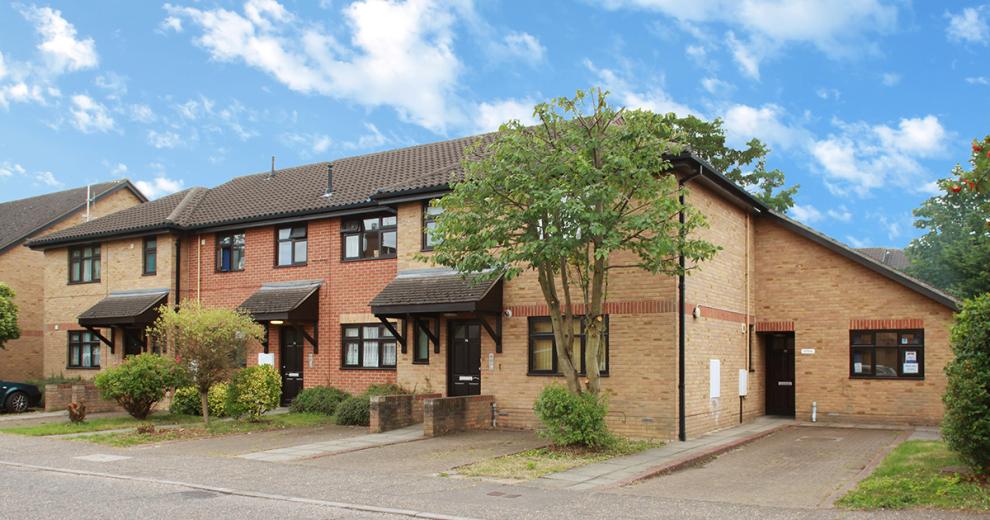 Contemporary brick-built dwelling with adjoining single storey set back addition with 45 degree angle roof seamlessly blending into the roof space of the home. Housing two off road car parking space for the supported living dwelling on Nickleby Road.