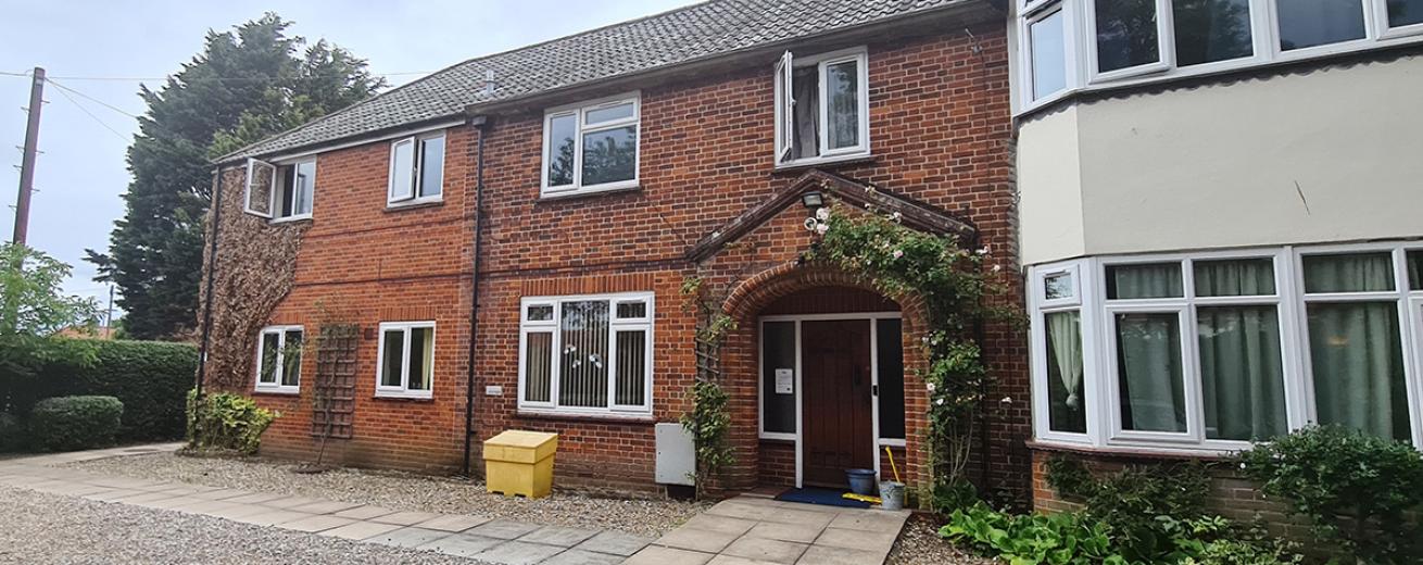 Traditional brick-built residence with rendered protruding bay windows, large arched porch to the entrance of the residence and a low maintenance block paving and stoned front garden.