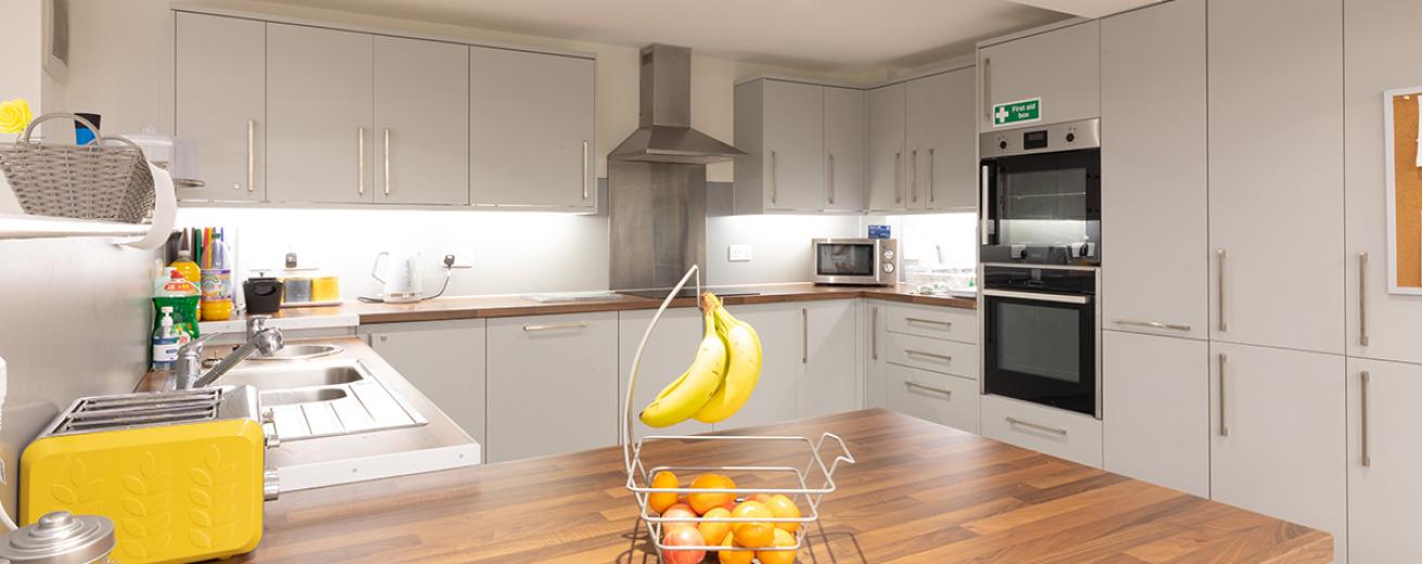 Beautiful, crisp, clean, communal kitchen. The spacious kitchen consists of modern appliances, with two ovens, an electric hob, large stainless steel microwave as well as introducing pops of colour in to the remaining appliances. There is an abundance of floor to ceiling storage options available.