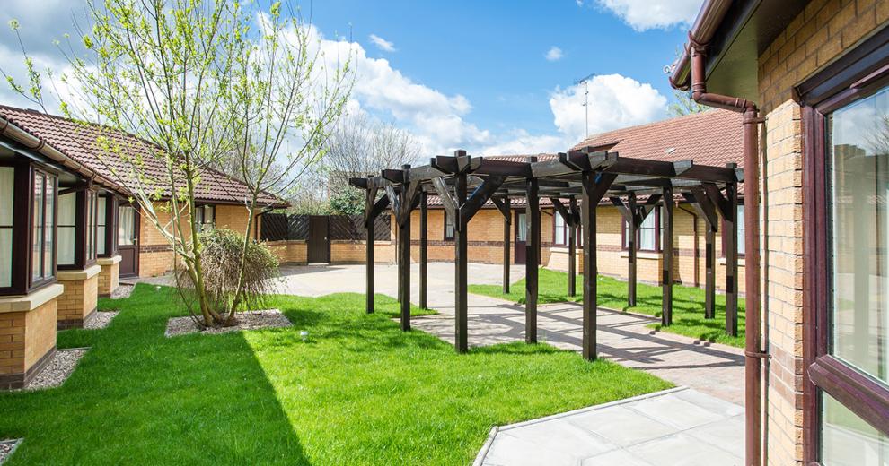 The passageways around the property lead to well-maintained small amount of grass area but open into large patio areas which have communal access.