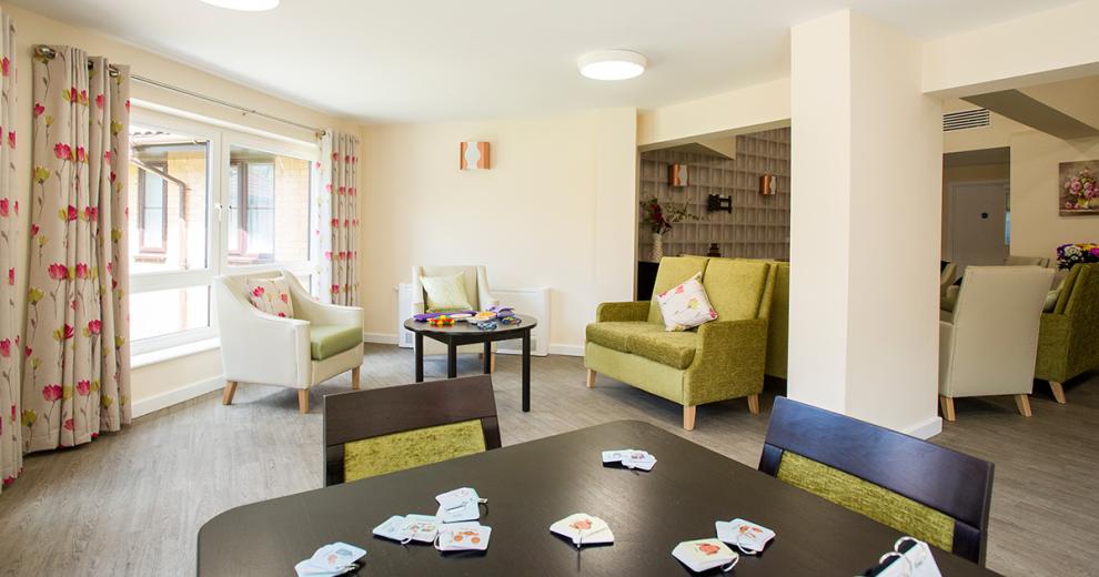 Following through are some beautifully placed window seating making the most of the abundance of natural light. All of the furniture is perfectly coordinated with the adjoining room.