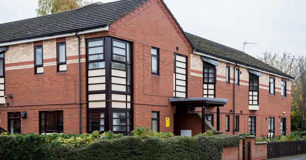 Red and yellow brick facility containing 10 fully furnished bedrooms, providing short-term and longer-term support, at Aldam House and Cottage.