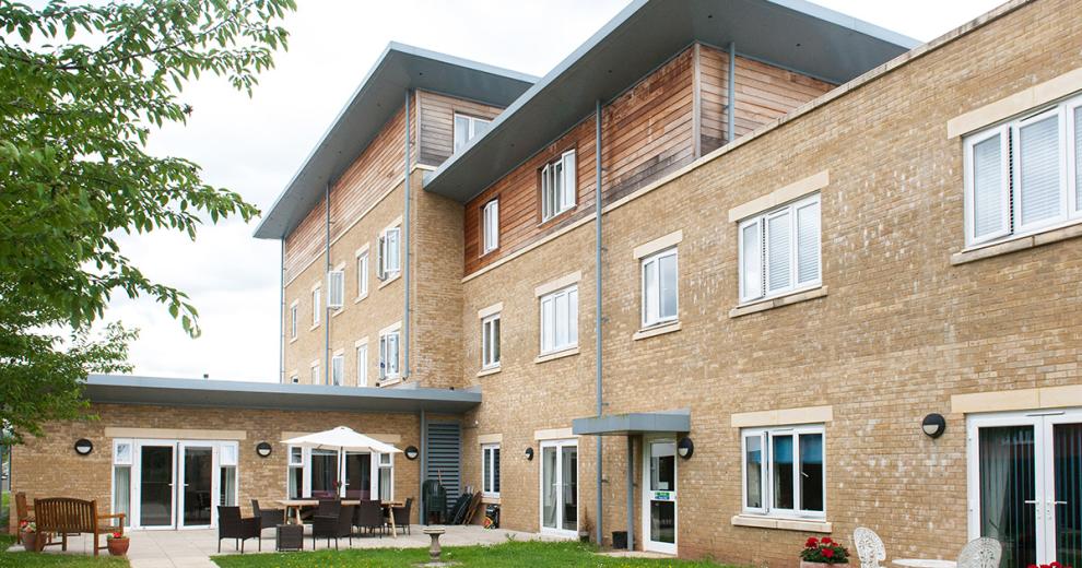 The multi elevational building uses a mixture of yellow brick and wooden panelling to create a step effect to the property. The property goes from a two storey into a three storey and finally into a four, a single storey elevation links out onto the patio garden area.