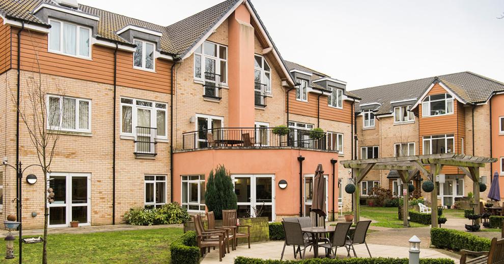 The considerably sized retirement living complex. The complex creates a corner plot for the property leaving it with a sizeable garden area with plenty of seating options and natural space. A outdoor balcony area has been built on top of the ground floor protruding elevation.
