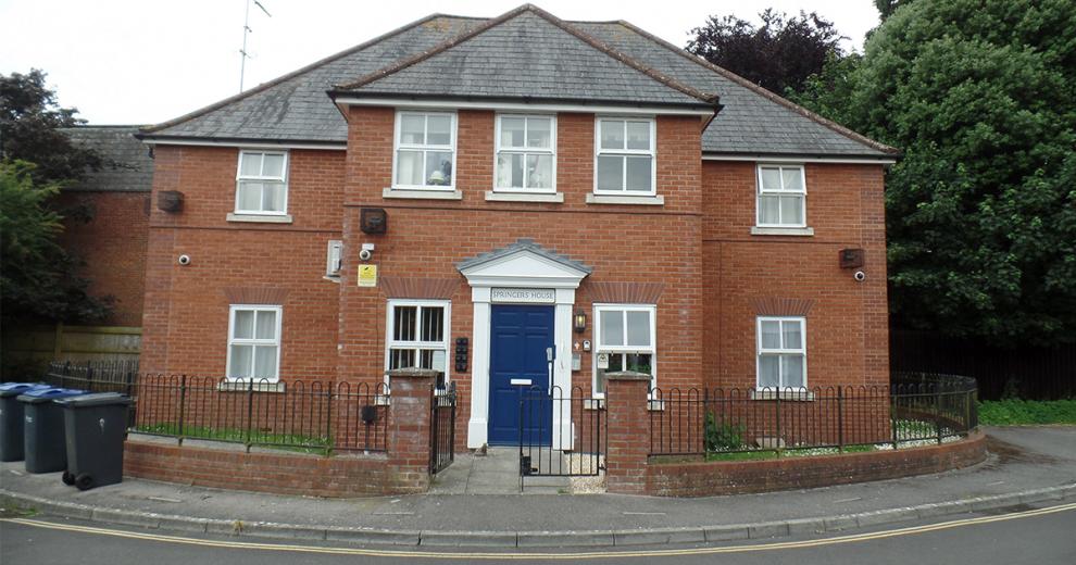 Graceful property with prominent featured blue door and white framework. An array of security features, including cameras, multiple lighting and a secure door.