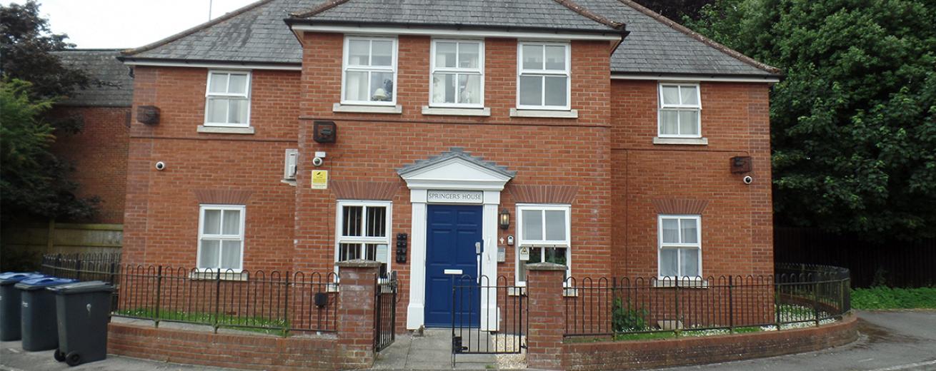Graceful property with prominent featured blue door and white framework. An array of security features, including cameras, multiple lighting and a secure door.