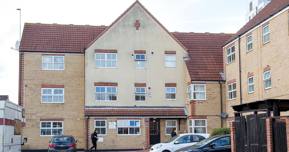 The characteristic, yellow brick built corner plot building, with a decorative red brick addition above the storey elevation wrapping the property and a magnitude of bright white framed windows decorating the exterior.