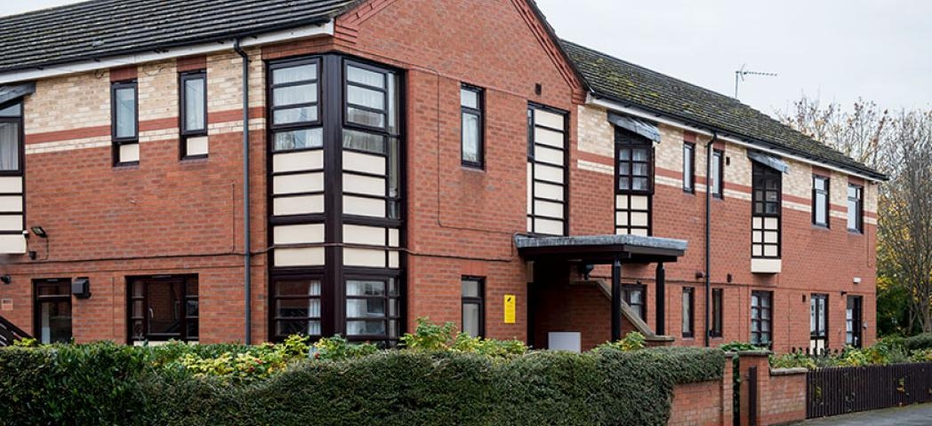 Red and yellow brick facility containing 10 fully furnished bedrooms, providing short-term and longer-term support, at Aldam House and Cottage.