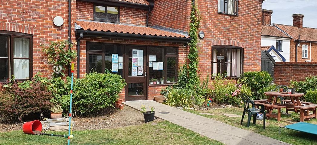 A statement brick-built residence, with different elevation levels and clay roof tiles. With an inviting front garden, consisting of seating area and homely plants.