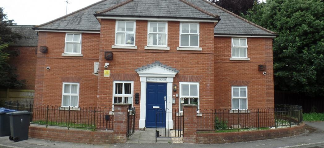 Graceful property with prominent featured blue door and white framework. An array of security features, including cameras, multiple lighting and a secure door.