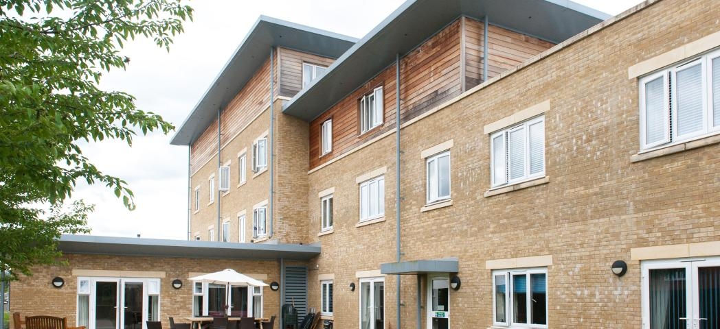 The multi elevational building uses a mixture of yellow brick and wooden panelling to create a step effect to the property. The property goes from a two storey into a three storey and finally into a four, a single storey elevation links out onto the patio garden area.