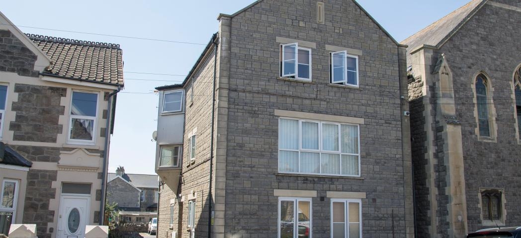 Charming limestone supported housing property at Moorland Road, with left side driveway access to rear parking.