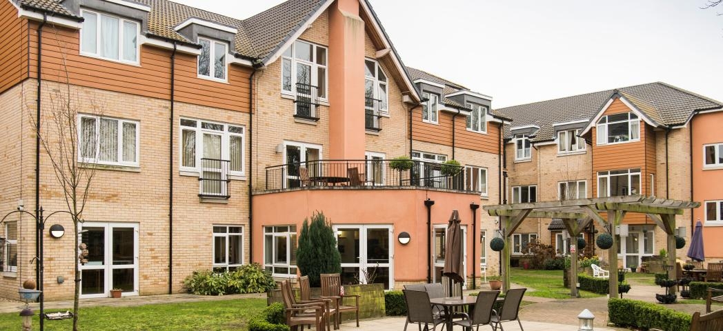 The considerably sized retirement living complex. The complex creates a corner plot for the property leaving it with a sizeable garden area with plenty of seating options and natural space. A outdoor balcony area has been built on top of the ground floor protruding elevation.