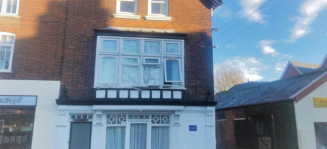 Three storey brick and rendered end of terrace property. With access to the right hand side.