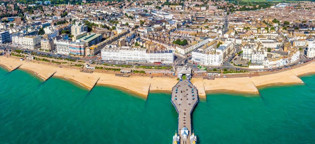 Scenic view of the turquoise sea surrounding the grand pier and town of Eastbourne.