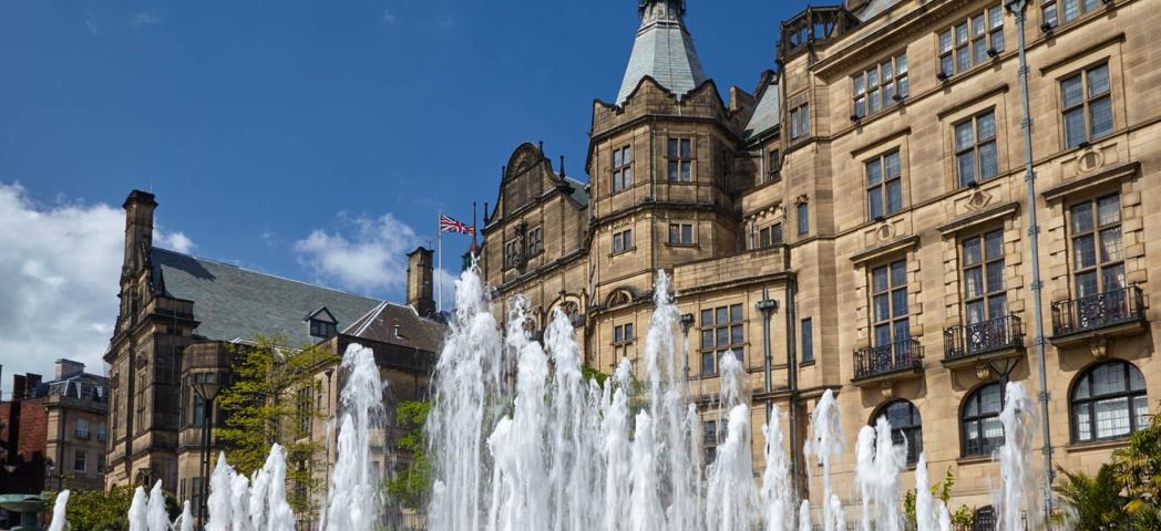 Active water fountain in front of the neo-Gothic building of Sheffield Town Hall.  