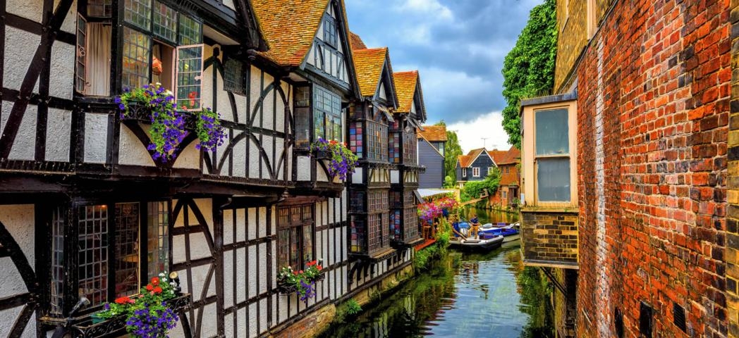 Medieval half-timber houses built on the river with boat access and mooring.