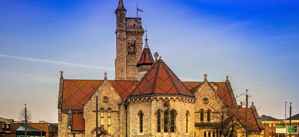 Christ church a 19th Century church, built from natural stone and decorative red roofing turrets. 