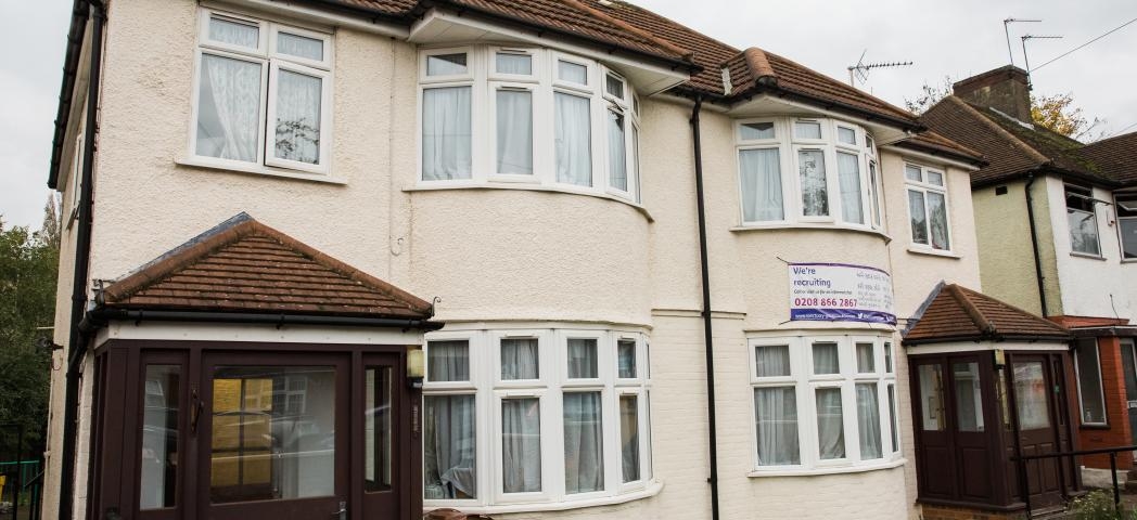 Semi-detached, white rendered residential care property at High Worple.  