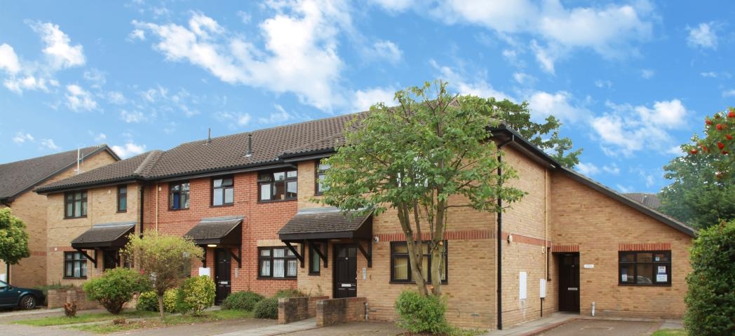 Contemporary brick-built dwelling with adjoining single storey set back addition with 45 degree angle roof seamlessly blending into the roof space of the home. Housing two off road car parking space for the supported living dwelling on Nickleby Road.