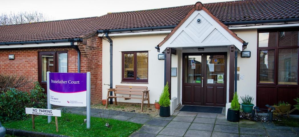 Single storey rendered, and brick built residential care home, Pennefather Court. The setback entryway has an enticing feel with the ageless brown and white décor. 