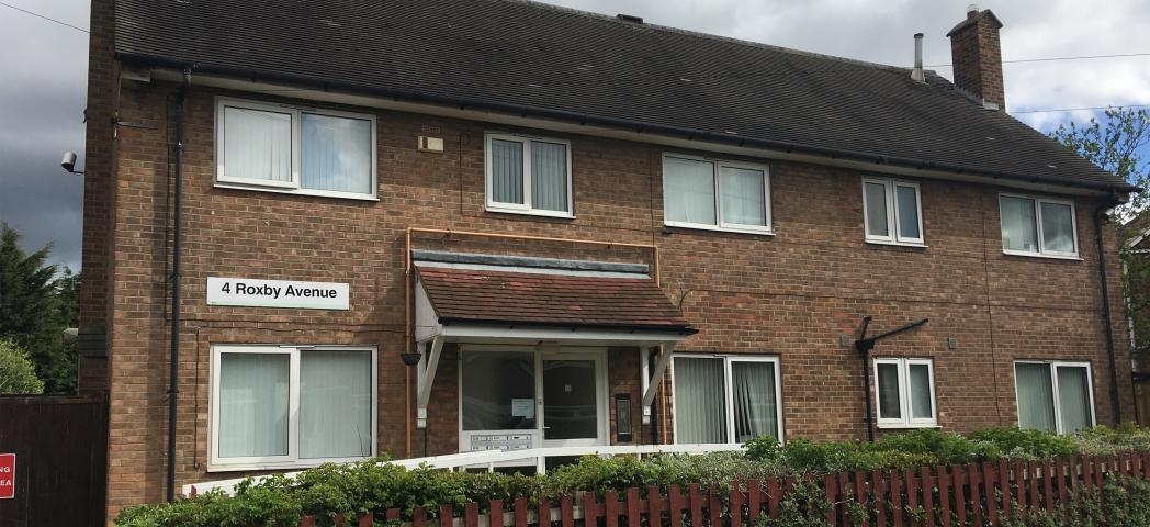 Conventional 50’s style brick shared house for people aged 16 and over, with a range of learning disabilities. Hosting disabled access and privacy from a mahogany picket fence and shrubbery.