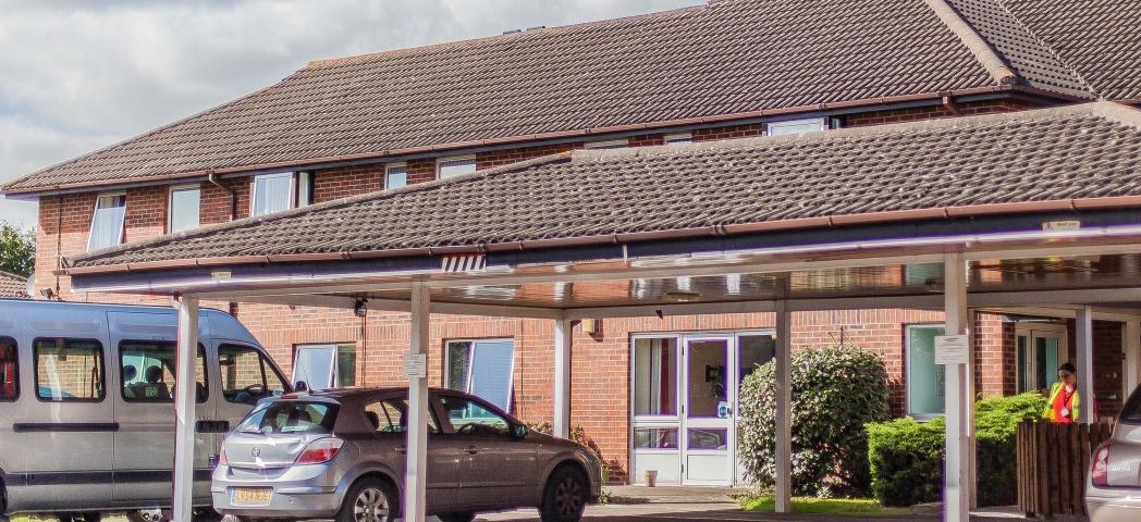 Large two storey residential care and supported living facility at Shaftebury Place. With easy dropped curb access and extended covered porch. 