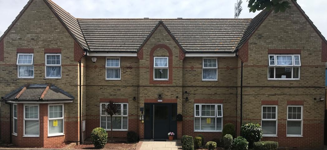 The broad property has a setback entrance way lined with small shrubbery plants providing entry to the young parents supported housing in Southend on Sea.  