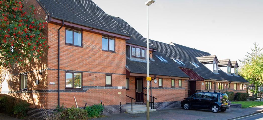 Multi elevation building design, fluctuating between two storey and single storey property with multiple entry points for all accessibility needs. Sycamore Court provides personal care for adults with a range of learning disabilities.
