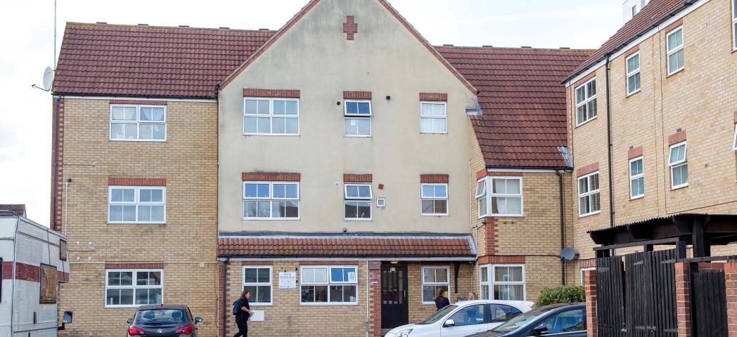 The characteristic, yellow brick built corner plot building, with a decorative red brick addition above the storey elevation wrapping the property and a magnitude of bright white framed windows decorating the exterior. 