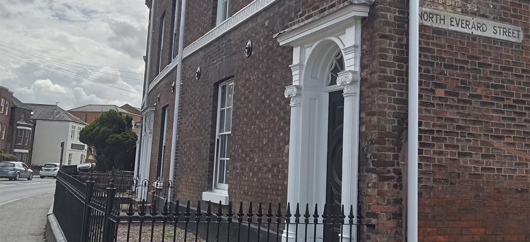 Exterior image of Merchant Terrace a dark bricked townhouse 