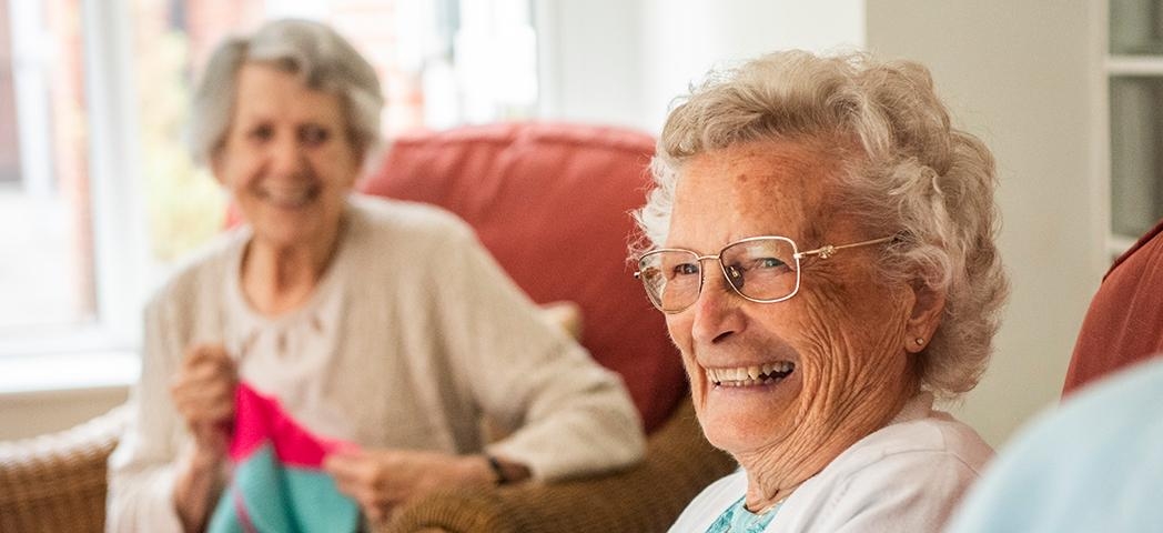 Two Supported Living residents laughing together