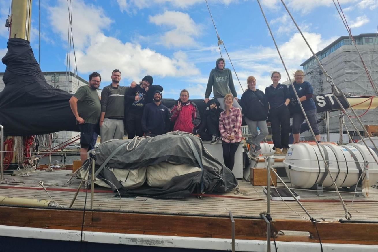 Residents of the scheme on board a sailing boat